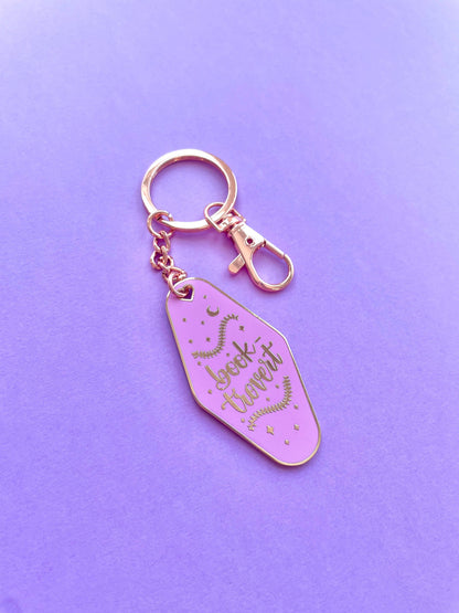 Booktrovert Hotel Keychain by Galloree Designs LLC in Purple with metal clip attachment and gold key fob style