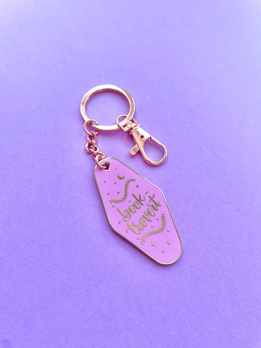 Booktrovert Hotel Keychain by Galloree Designs LLC in Purple with metal clip attachment and gold key fob style