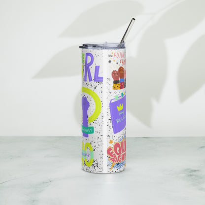 A tall, slim stainless steel tumbler with a clear lid and metal straw, decorated with colorful feminist-themed graphics and text, standing on a light marble surface against a white wall with leaf shadows.