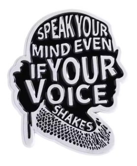 A black and white enamel pin shaped like a stylized profile of a person with a beanie, featuring the text 'SPEAK YOUR MIND EVEN IF YOUR VOICE SHAKES' in white lettering on a black background.