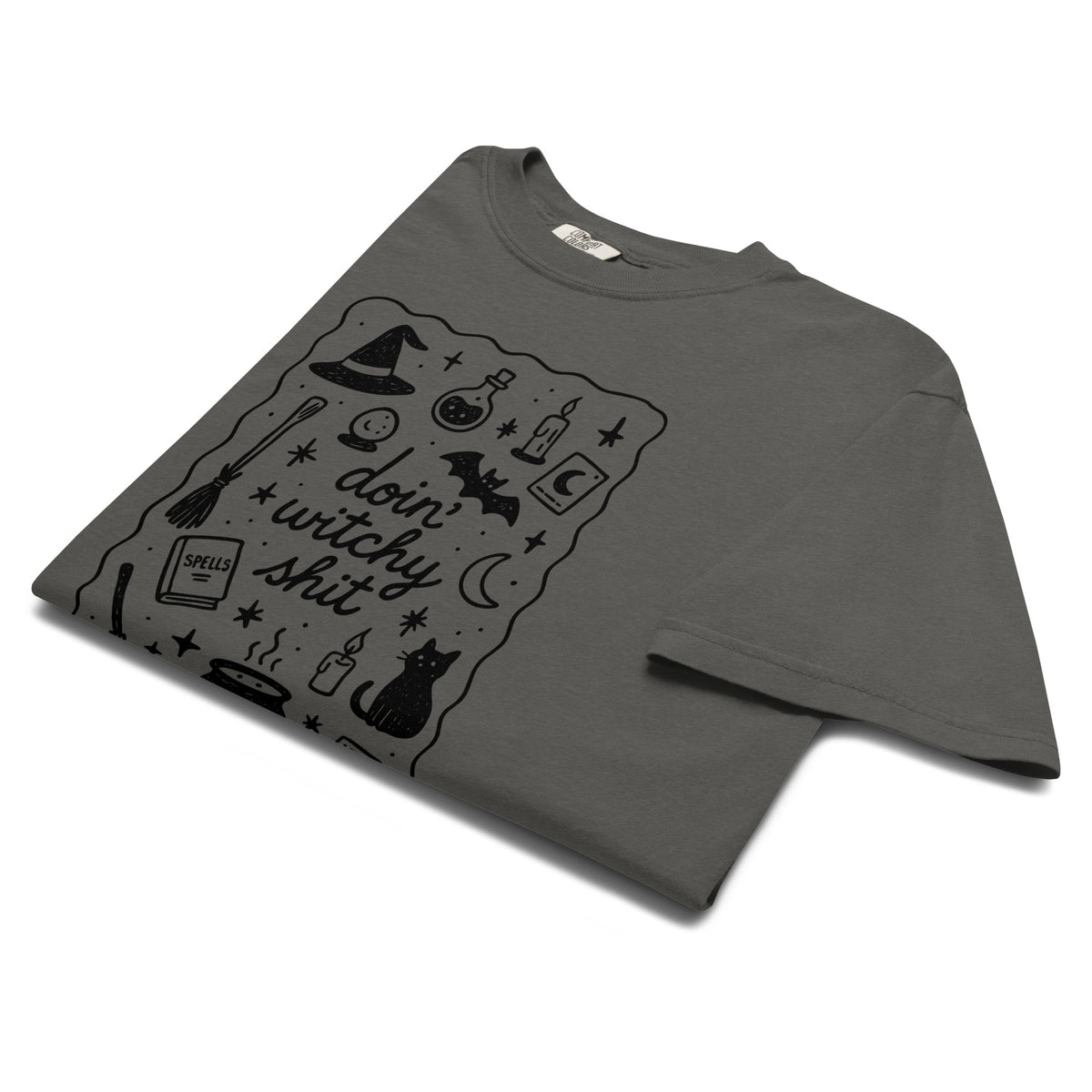 Folded product mockup of a grey comfort colors t-shirt with a witchy inspired graphic for Halloween