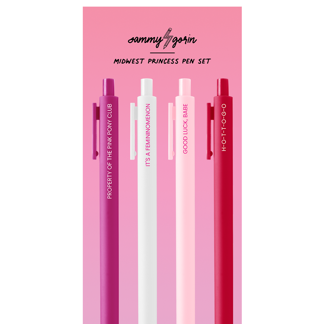 Four pen-style lip gloss tubes from Sammy Aggorin's Midwest Princess Pen Set, displayed vertically on a pink card. The pens are in shades of magenta, white, and red, each printed with a different phrase: 'PROPERTY OF THE PINK FLOYD CLUB', 'IT'S A FEMINOMENON', 'GOOD LUCK, BABE', and 'HOTTOGO'.