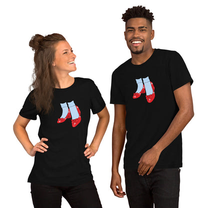 A man and woman wearing black Friends of Dorothy pride t-shirts with the ruby-slipper design.