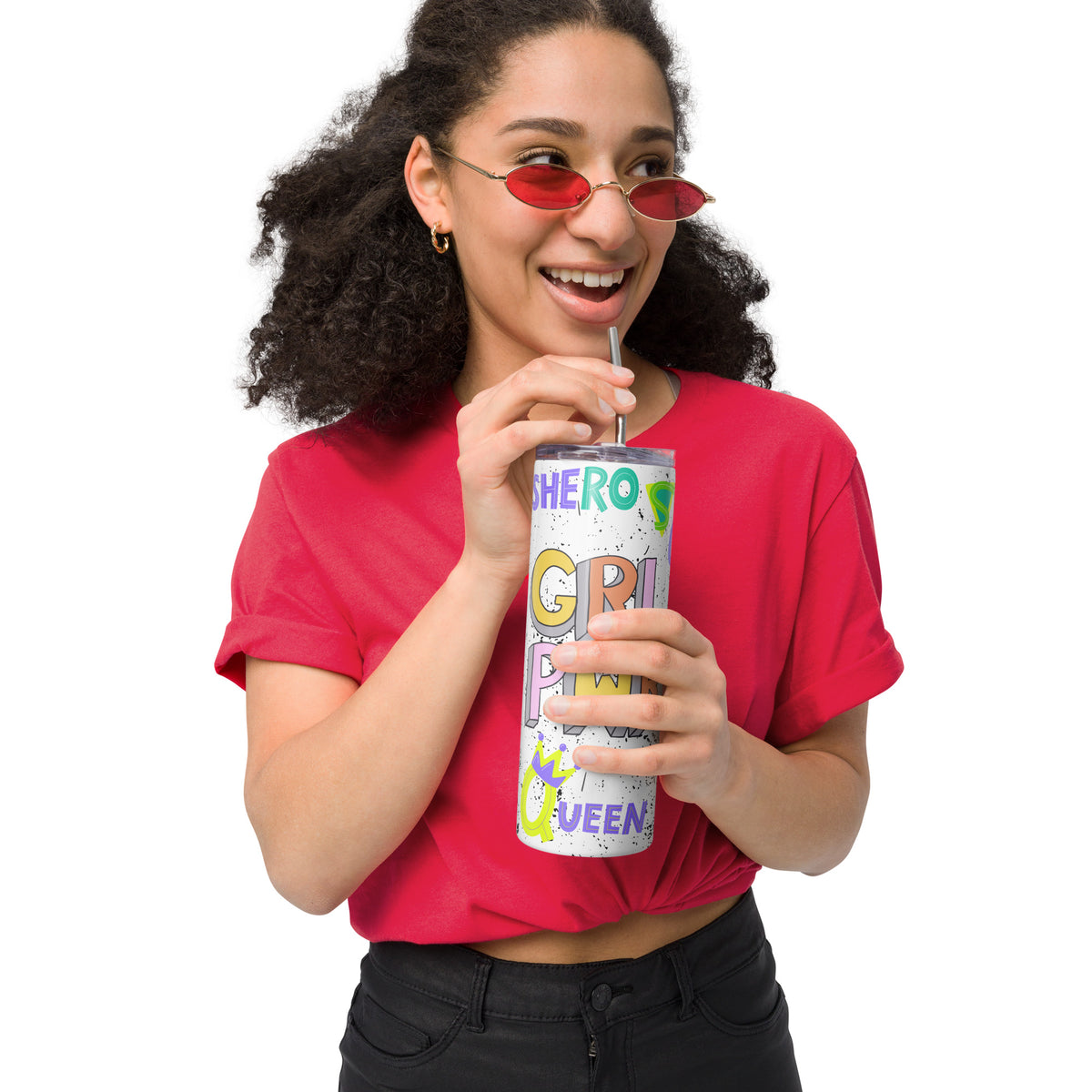 Person wearing a red shirt and sunglasses, holding a white tumbler with girl power graphic design with a straw.