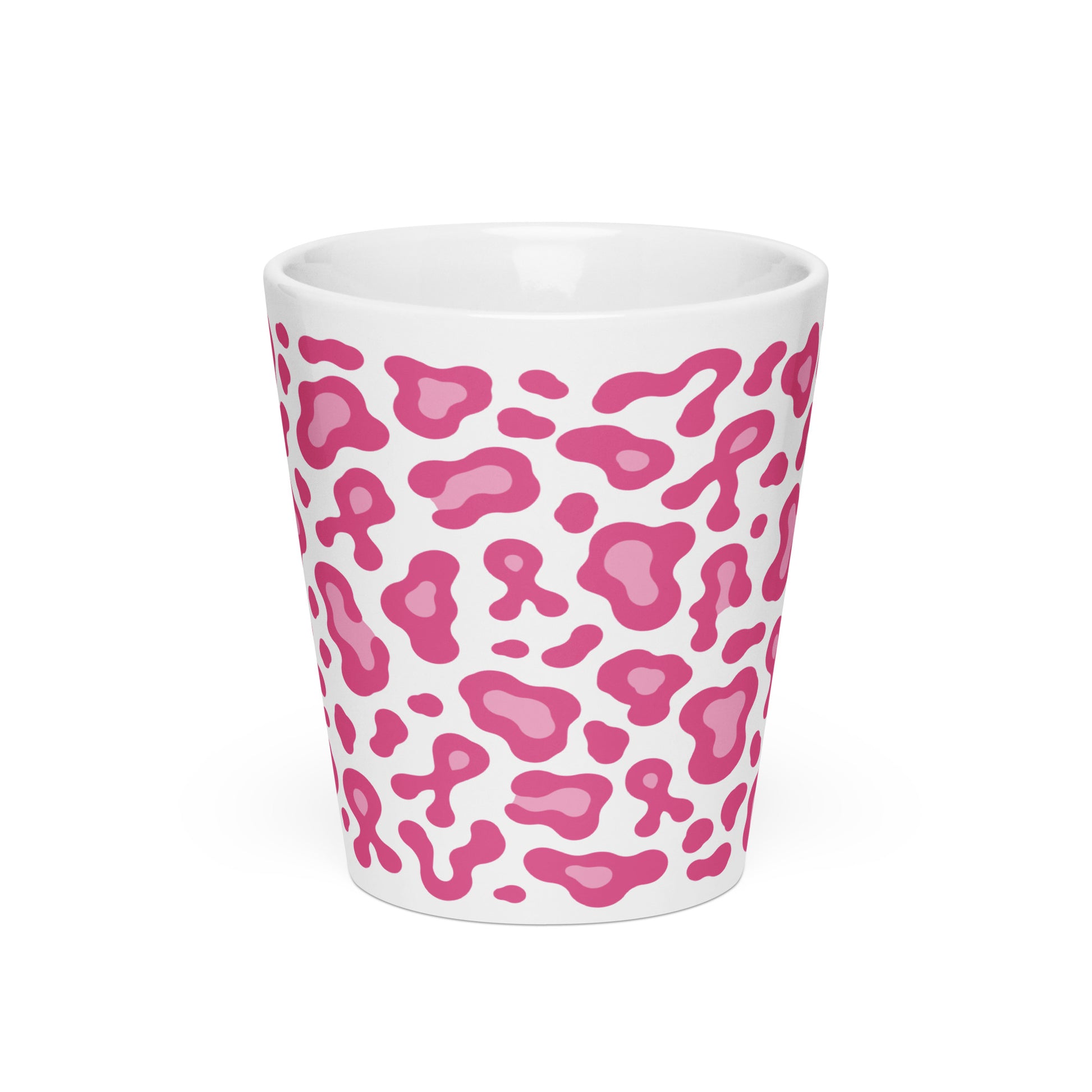 A white ceramic shot glass featuring a pink leopard print pattern, shown against a plain white background.