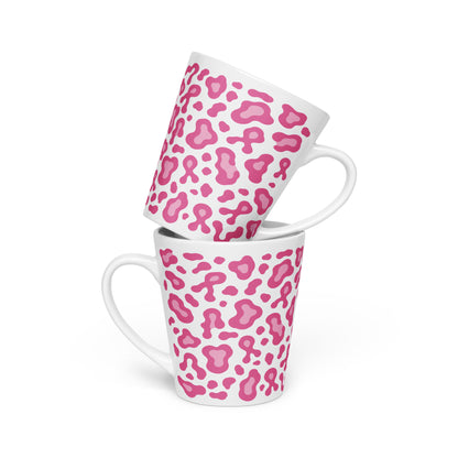Two white ceramic mugs with a pink leopard print pattern, stacked with one tilted on top of the other against a white background.