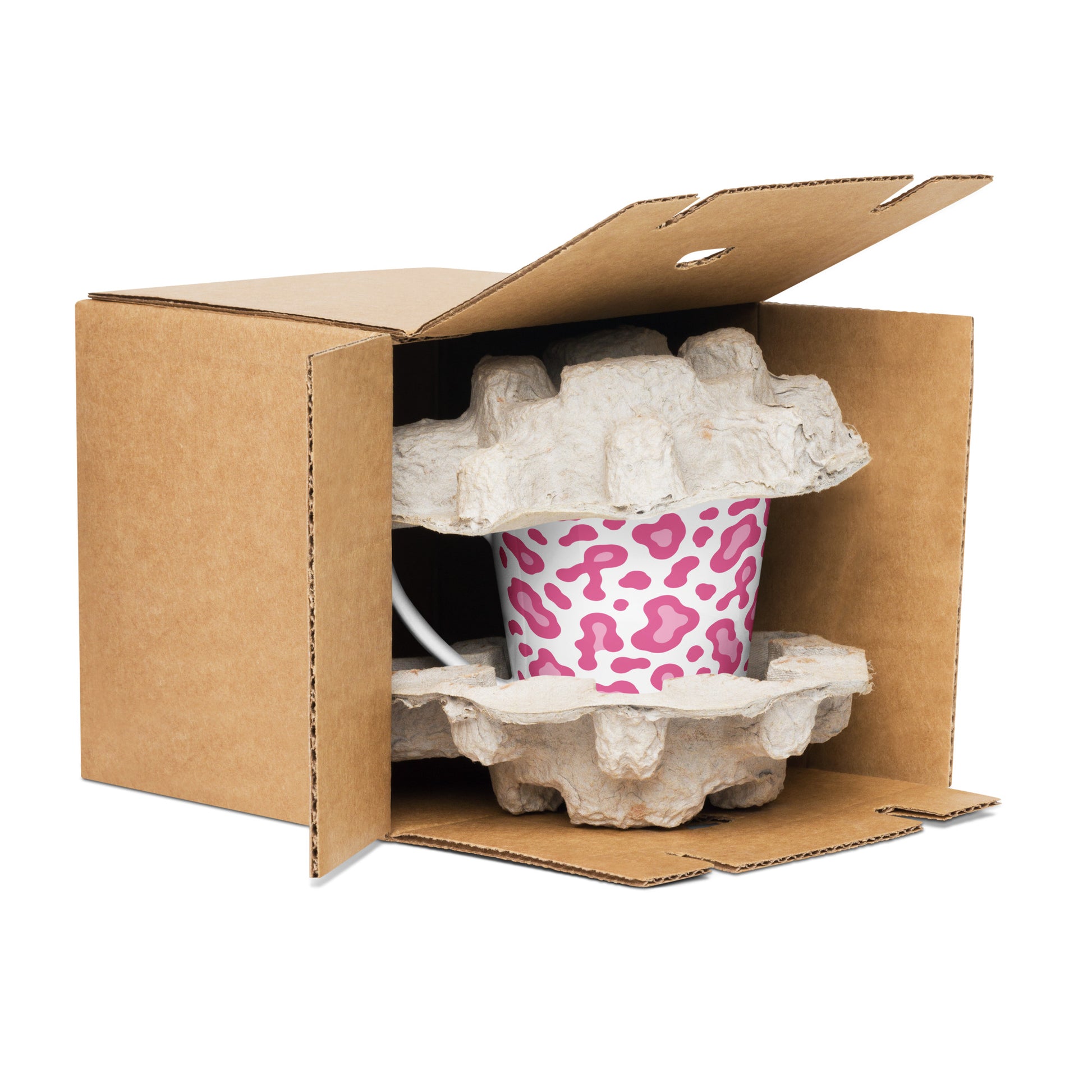 White mug with a colorful design in an open cardboard box with protective wrap.