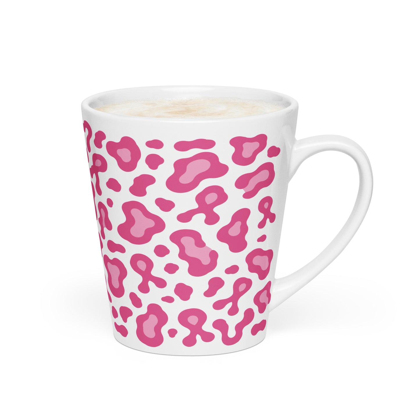 A white ceramic latte mug with a pink leopard print pattern, filled with a latte and photographed on a clean white background.