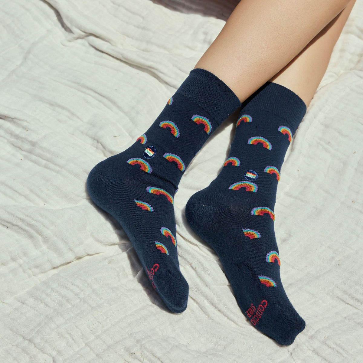 Socks that Save LGBTQ Lives — Navy Rainbow Crew Socks | LGBTQ+ Pride | Organic Cotton - Spinsterly Co