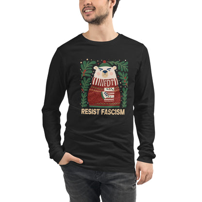 A man wearing a black long-sleeve t-shirt with a graphic of a polar bear in a red sweater and green wreath, with the text 'RESIST FASCISM' printed below.