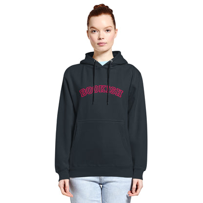 Person wearing a navy-blue hoodie with a pink embriderly that reads 'BOOKISH' in university style font on a white background