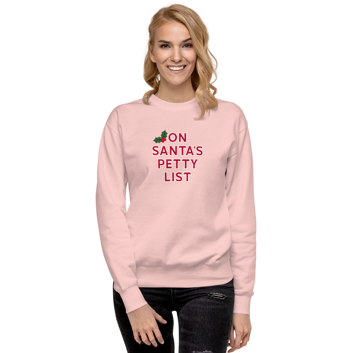 A woman modeling a cream-colored crewneck sweatshirt with the text 'BURN for what you LOVE' printed on the chest in orange, yellow, and pink, paired with dark jeans against a plain white background.