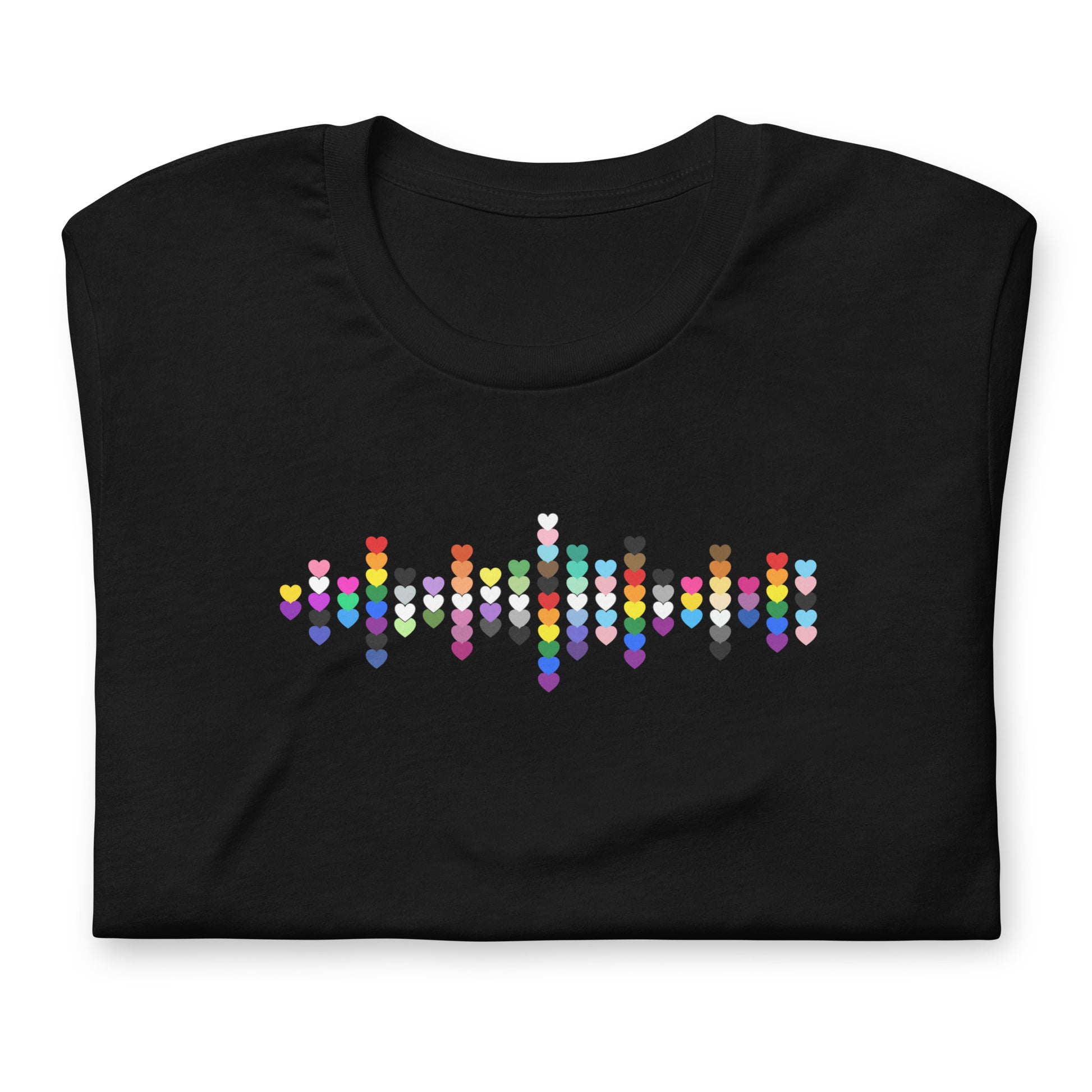 A flat lay folded black t-shirt with a Pride Heart graphic design across the chest.