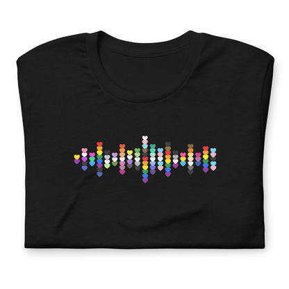 A flat lay folded black t-shirt with a Pride Heart graphic design across the chest.