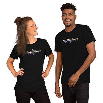 A smiling woman and man standing together, both wearing black t-shirts with a colorful Pride heart graphic on the chest.