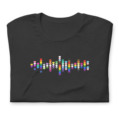 A flat lay folded grey t-shirt with a Pride Heart graphic design across the chest.