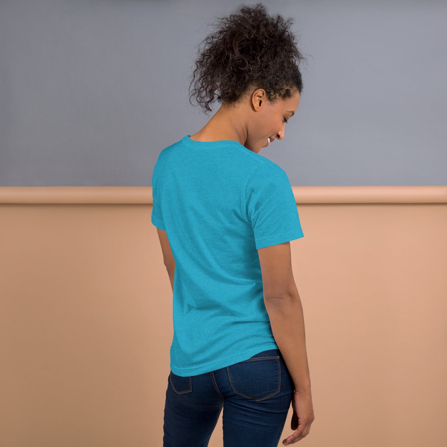 view of woman from behind, featuring the back of the heather aqua t-shirt.
