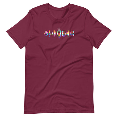 A flat lay maroon t-shirt with a Pride heart graphic design across the chest