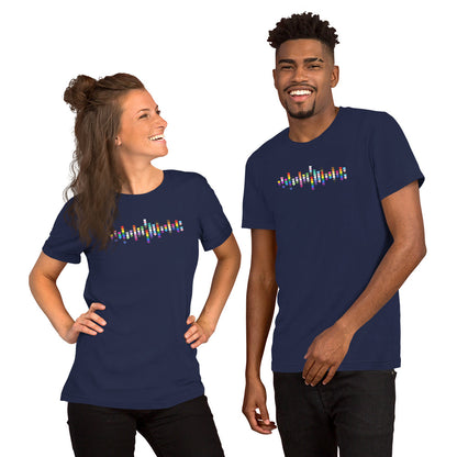 A smiling woman and man standing together, both wearing navy blue t-shirts with a colorful Pride hearts graphic on the chest.