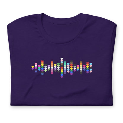 A flat lay folded purple t-shirt with a Pride Heart graphic design across the chest.