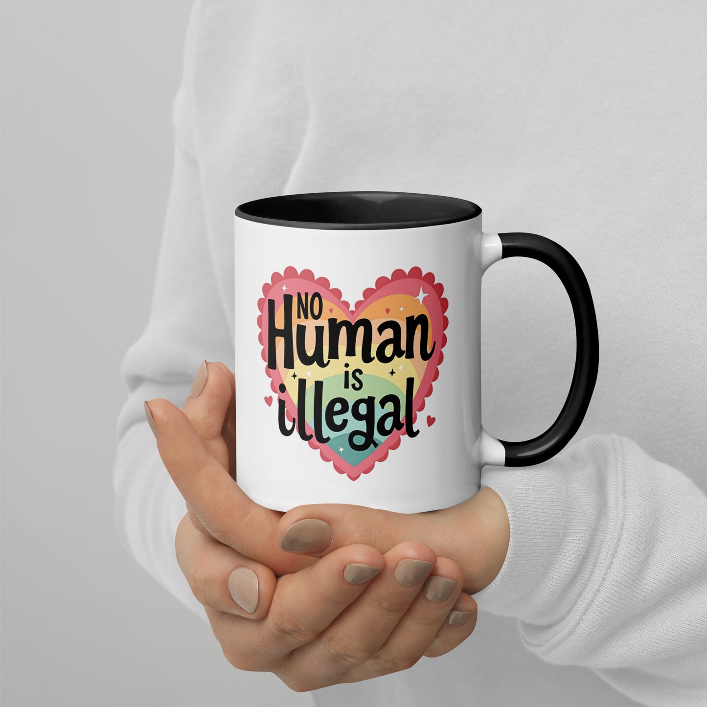 No Human is Illegal Rainbow Heart Accent Coffee Mug Spinsterly Co ceramic mug with glossy finish and black interior