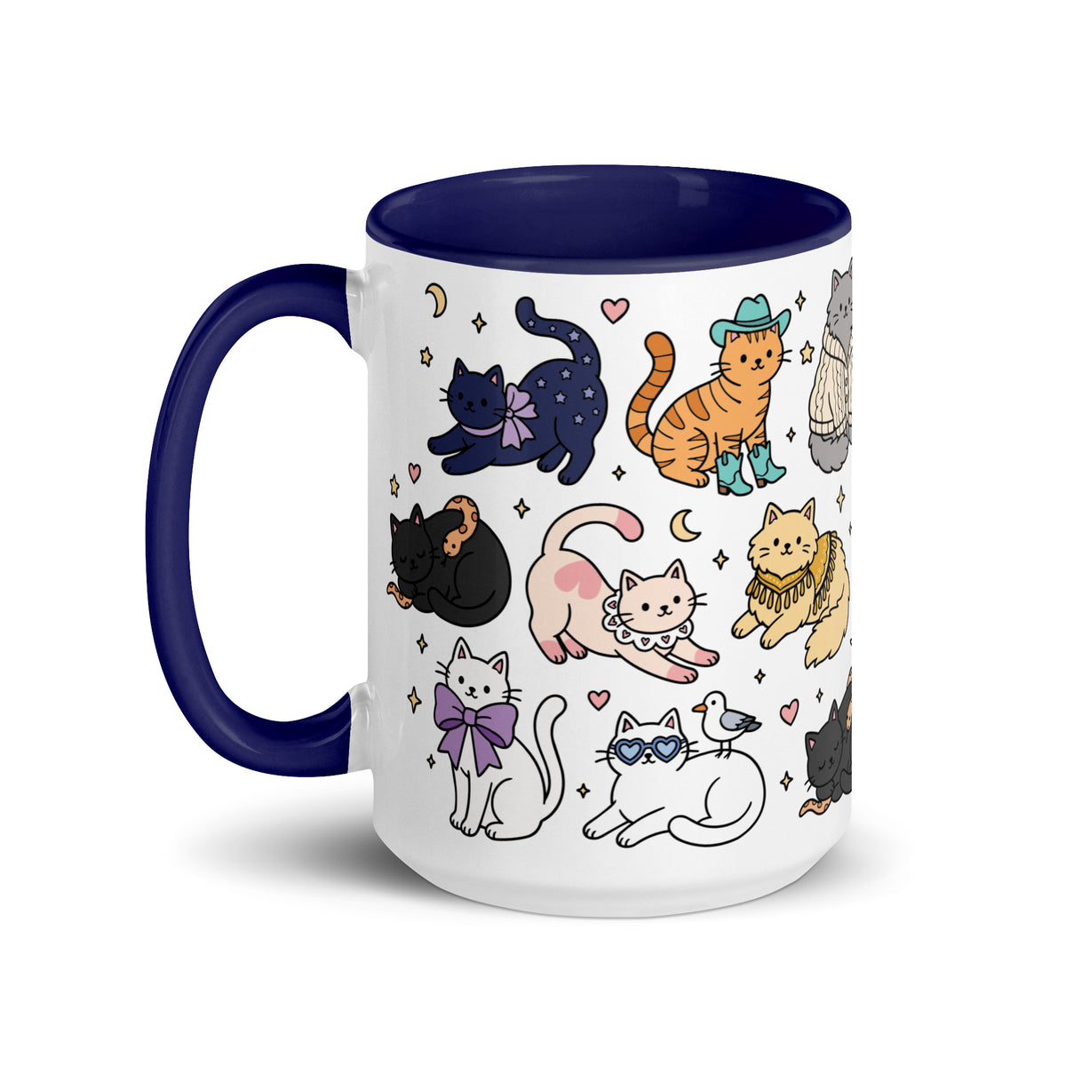 A white ceramic mug with a dark navy blue handle and interior, decorated with a whimsical pattern of various cartoon cats in different poses and outfits.