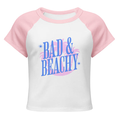 Bad and Beachy Micro Rib Raglan Baby Tee Spinsterly Co pink and white raglan baby tee with retro Bad and Beachy print