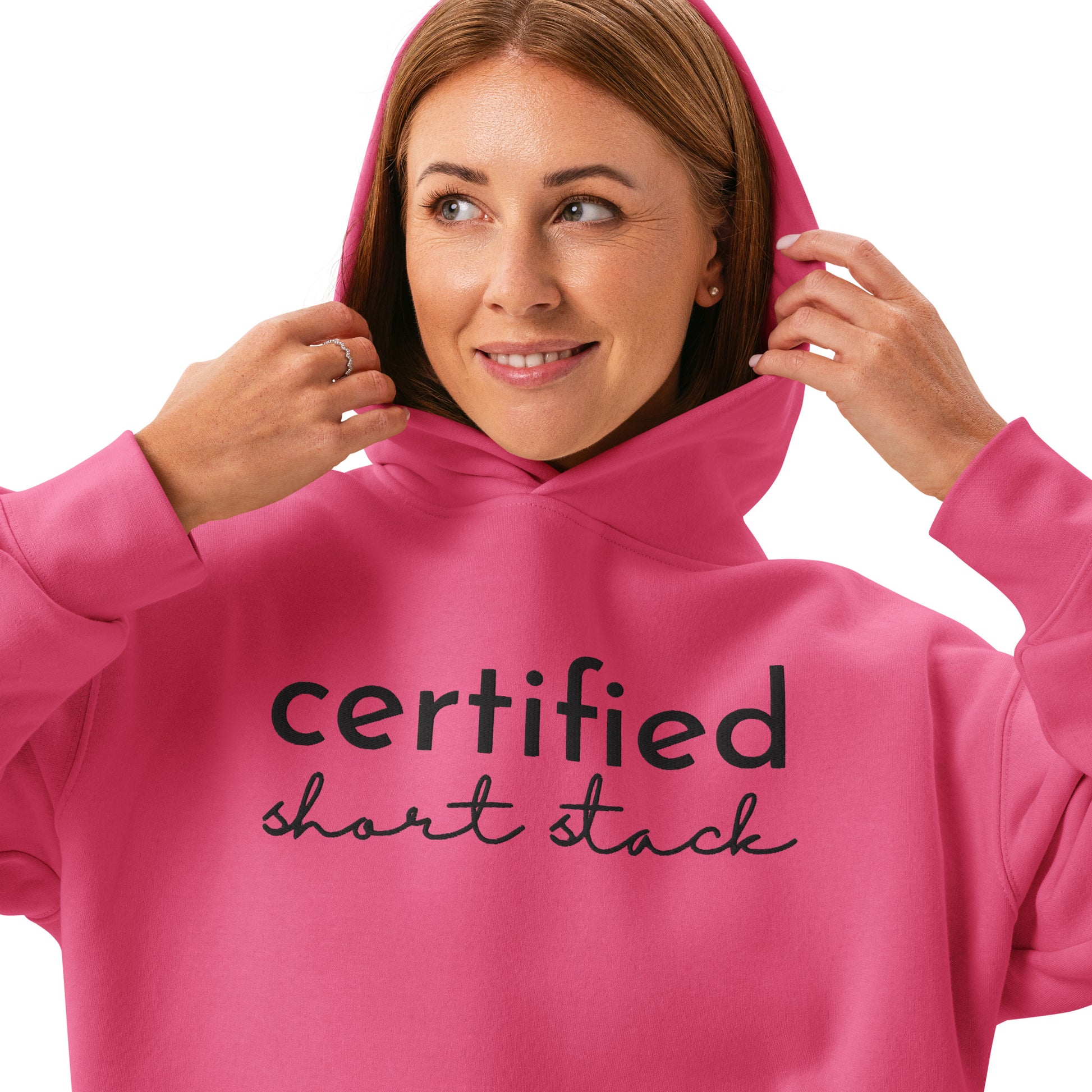 Person wearing a pink hoodie with 'certified short stack' text on a white background