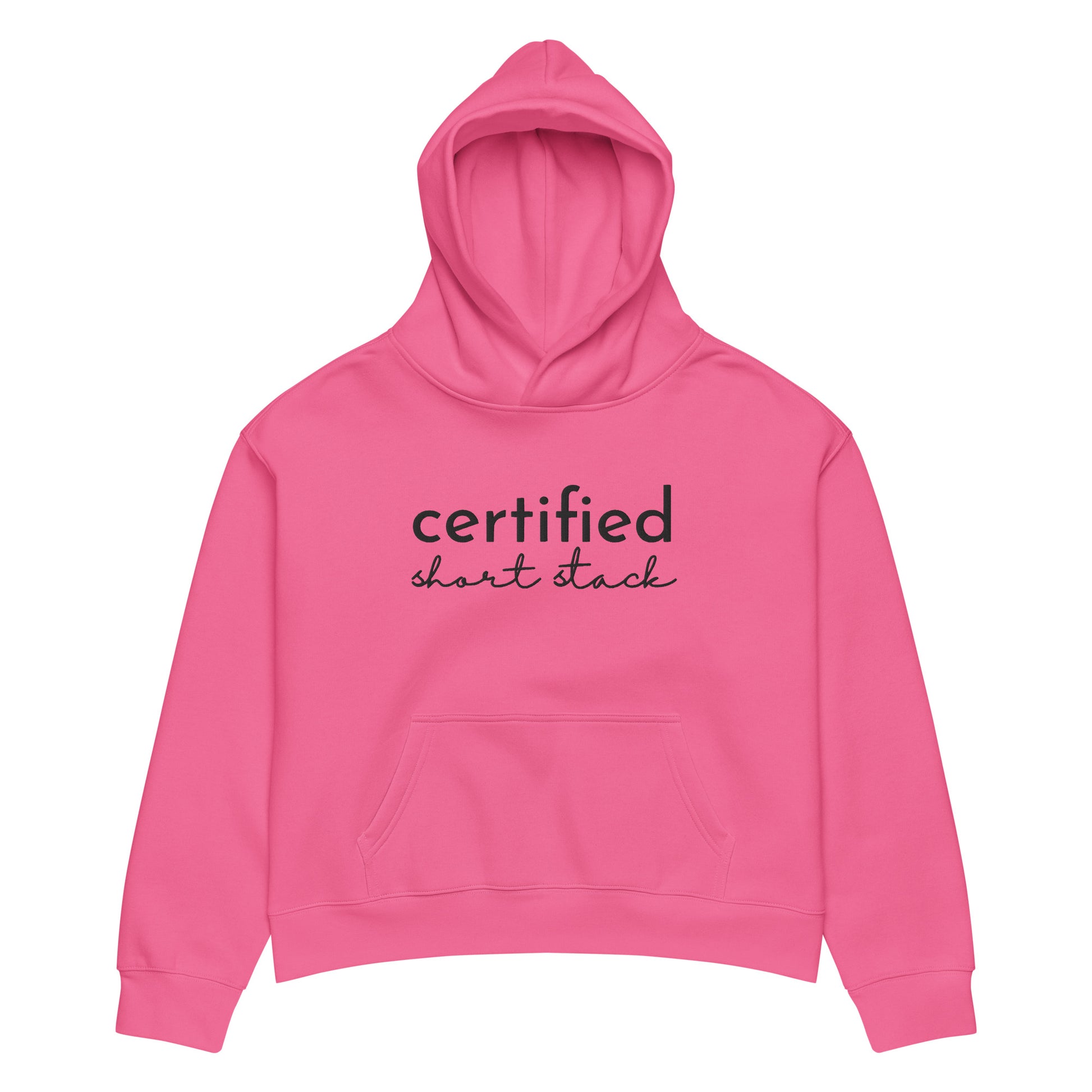 A bright pink cropped hoodie with 'certified short stack' printed in black across the chest, displayed on a clean white background.