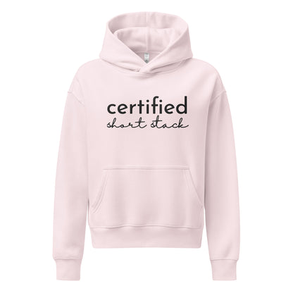 A light pink pullover hoodie with 'certified short stack' printed in black across the chest, displayed on a clean white background.